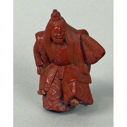 272A - A JAPANESE RED LACQUERED NETSUKE DEPICTING A FIGURE, SIGNED TO BASE
5.8cm H