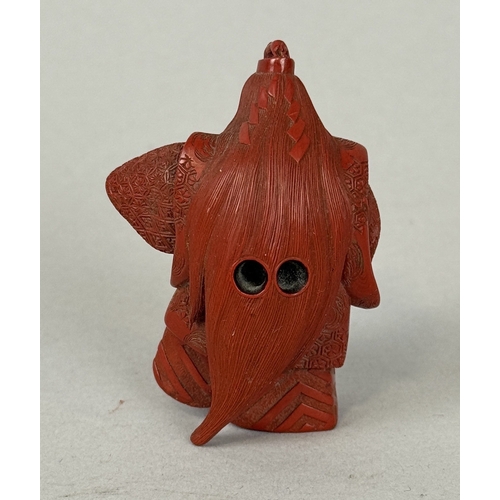 272A - A JAPANESE RED LACQUERED NETSUKE DEPICTING A FIGURE, SIGNED TO BASE
5.8cm H