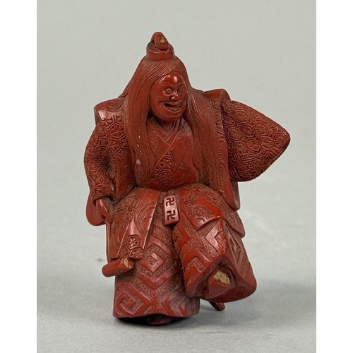 272A - A JAPANESE RED LACQUERED NETSUKE DEPICTING A FIGURE, SIGNED TO BASE
5.8cm H