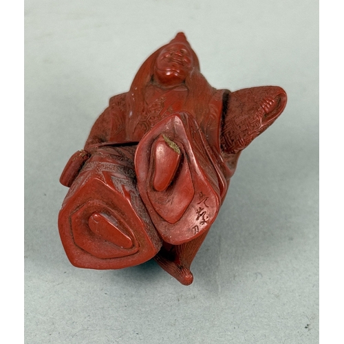 272A - A JAPANESE RED LACQUERED NETSUKE DEPICTING A FIGURE, SIGNED TO BASE
5.8cm H