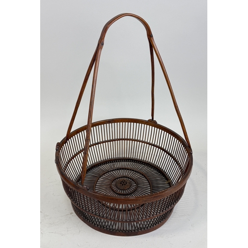 272B - A JAPANESE WOODEN BASKET, SIGNED TO CENTRE
45cm x 35cm