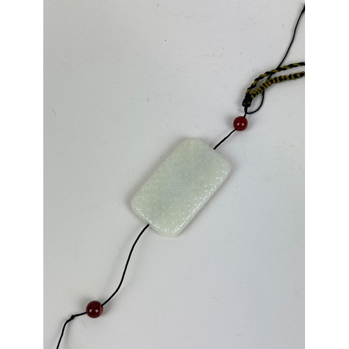 274 - A CHINESE JADE PENDANT
6.5cm L