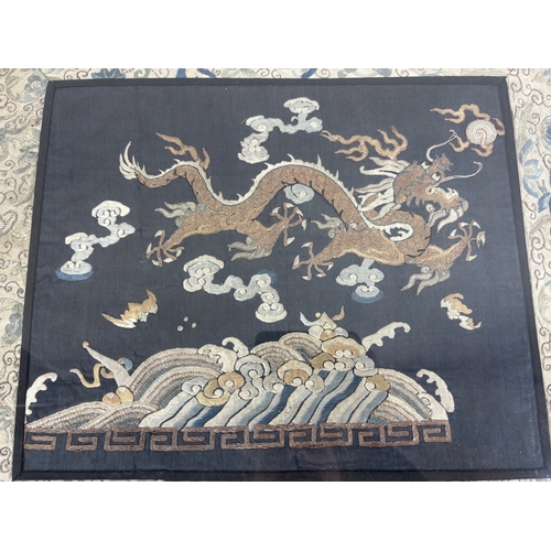286 - A CHINESE RANK BADGE DEPICTING A DRAGON CHASING THE SUN
Framed and Glazed: 49cm x 44cm
 ... 