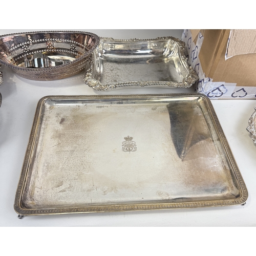 141 - A LARGE COLLECTION OF SILVER PLATED ITEM TO INCLUDE TRAYS, BASKET, CUTLERY