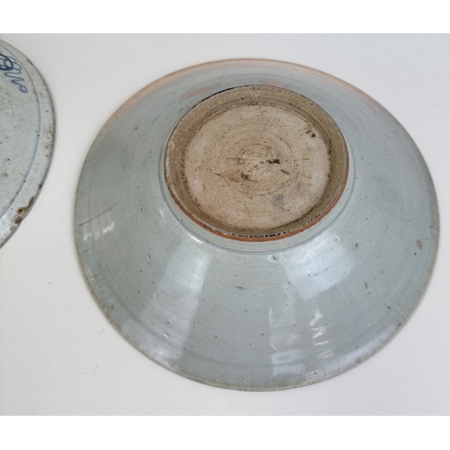 204 - TWO 18TH CENTURY OR EARLIER CHINESE/SOUTH EAST ASIAN BLUE AND WHITE DISHES
Largest 26cm W... 