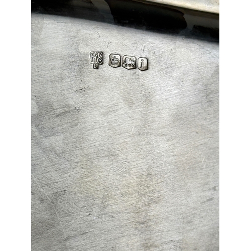 62 - A STERLING SILVER TWIN HANDLE DISH
31cm x 26cm
Weight: 798gms