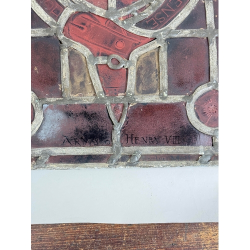 296 - AN ANTIQUE STAINED GLASS WINDOW INSCRIBED ARMS OF HENRY VIII, EMILUS MOLL, LONDON
45cm x 36cm... 