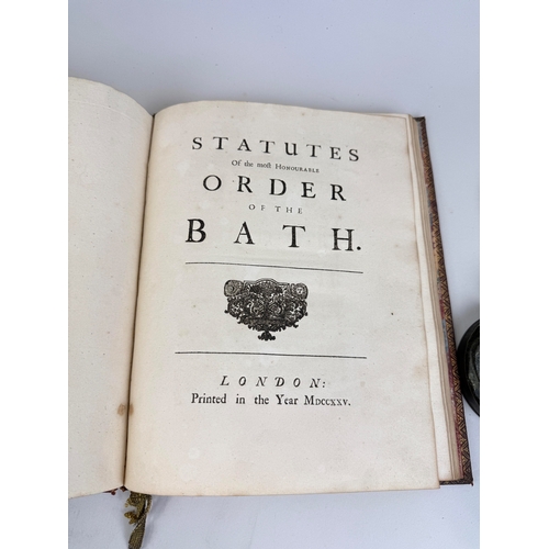 298 - A SEAL OF THE ORDER OF THE BATH AND A 1725 COPY OF 'THE STATUES OF THE ORDER OF THE BATH'