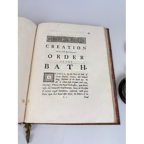 298 - A SEAL OF THE ORDER OF THE BATH AND A 1725 COPY OF 'THE STATUES OF THE ORDER OF THE BATH'