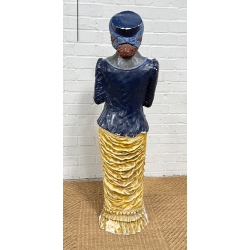 300 - A LARGE PAINTED PLASTER FIGURE OF A LADY, POSSIBLY OF A SUFFRAGETTE
111 cm