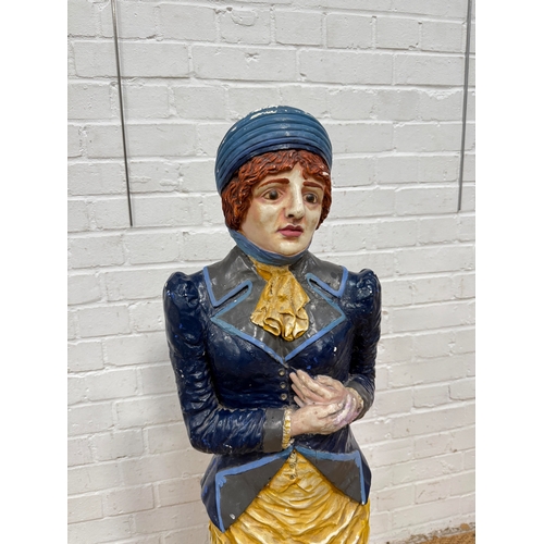 300 - A LARGE PAINTED PLASTER FIGURE OF A LADY, POSSIBLY OF A SUFFRAGETTE
111 cm