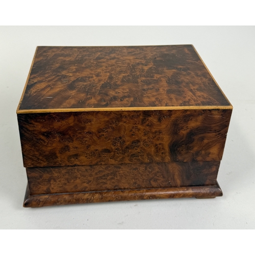 308 - A BURR WALNUT MUSICAL CIGAR BOX
19cm x 14cm x 11.5cm