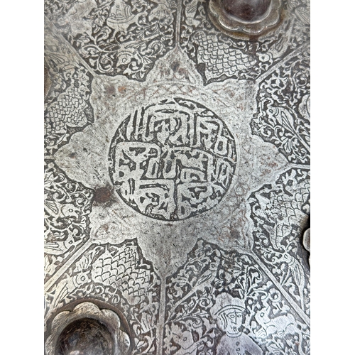 316 - AN INDO-PERSIAN SHIELD, 19TH CENTURY OR EARLIER
Possibly Islamic or Indian.
38cm W
Intricatedly deco... 