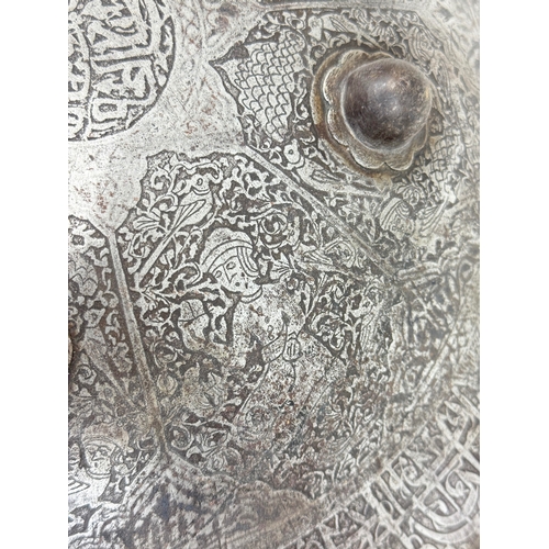 316 - AN INDO-PERSIAN SHIELD, 19TH CENTURY OR EARLIER
Possibly Islamic or Indian.
38cm W
Intricatedly deco... 
