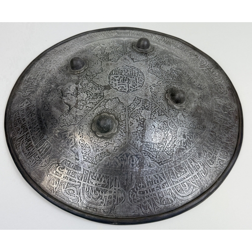 316 - AN INDO-PERSIAN SHIELD, 19TH CENTURY OR EARLIER
Possibly Islamic or Indian.
38cm W
Intricatedly deco... 