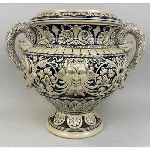 328 - A MINTON-STYLE MAJOLICA TWIN HANDLED VASE WITH DOLPHIN HEAD HANDLES AND CENTRAL MASKS
51 x 41 cm... 