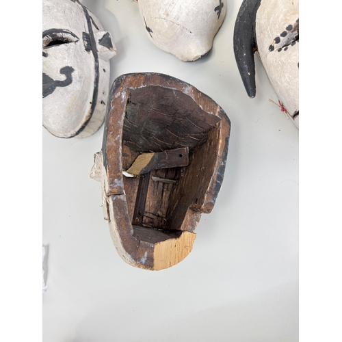 335 - A COLLECTION OF EIGHT PAINTED IBIBIO WOODEN AFRICAN HEADS
Purchased from Bonhams, Lots Road.... 