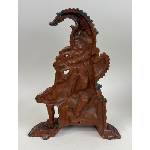 338 - A VICTORIAN PUNCH DOOR STOP
31cm Tall.