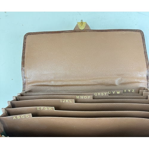 342 - ASPREY & CO LONDON: A TAN CROCODILE SKIN TRAVEL FOLIO WITH BRASS BRAMAH LONDON LOCK
35 x 26 cm... 