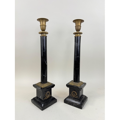 343 - A PAIR OF CLASSICAL COLUMN MARBLE AND BRASS CANDLESTICKS
52 cm H
