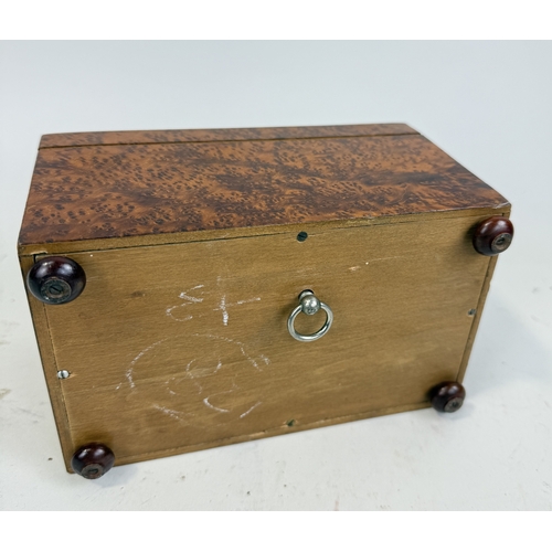 465 - BURR WALNUT MUSICAL CIGARETTE BOX
18 CM BY 10 CM BY 11 CM