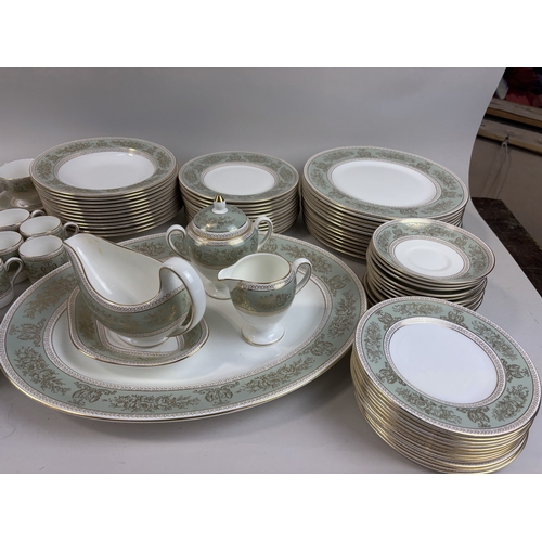 474 - A GOLD COLUMBIA WEDGWOOD DINNER AND PART TEA SERVICE IN SAGE GREEN
Includes dinner plates, side plat... 