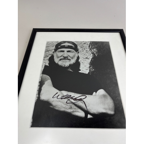 506 - A SIGNED PHOTOGRAPH OF WILLIE NELSON
24cm x 19cm