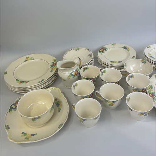 521 - A GROUP OF ROYAL DOULTON MINDEN CHINA TO INCLUDE TEA CUPS, DINNER PLATES, SIDE PLATES AND SERVING DI... 