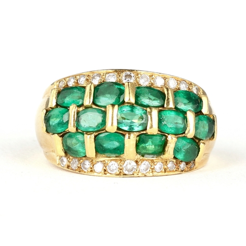 12 - AN 18CT GOLD RING SET WITH EMERALDS AND DIAMONDS
Weight: 12gms