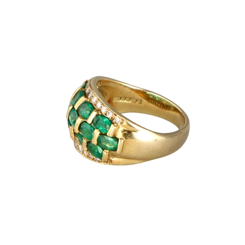 12 - AN 18CT GOLD RING SET WITH EMERALDS AND DIAMONDS
Weight: 12gms