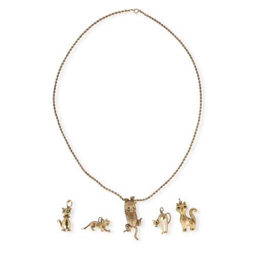 14 - A MODERN 9CT GOLD ARTICULATED PENDANT IN THE FORM OF A CAT, WITH STONE SET EYES, ON A 9CT GOLD TWIST... 