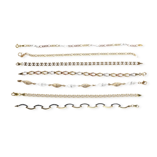16 - SEVEN 9CT TWO AND THREE COLOUR GOLD BRACELETS, OF VARYING DESIGNS
Total weight: 23.6 gms... 