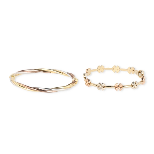 20A - A MODERN 9CT GOLD THREE COLOUR TWISTED BRACELET, TOGETHER WITH ANOTHER WITH ALTERNATING TWO-COLOUR F... 