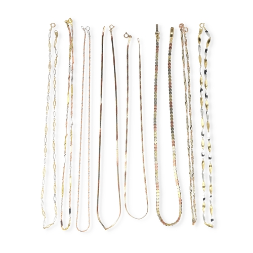 28 - EIGHT 9CT TWO AND THREE COLOUR GOLD NECK CHAINS OF VARYING DESIGNS
Total weight: 24.5 gms... 