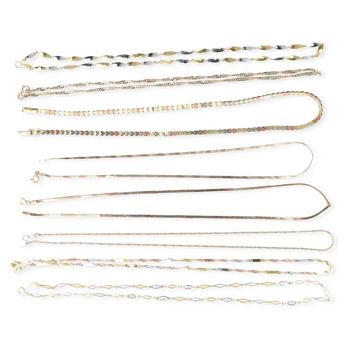 28 - EIGHT 9CT TWO AND THREE COLOUR GOLD NECK CHAINS OF VARYING DESIGNS
Total weight: 24.5 gms... 