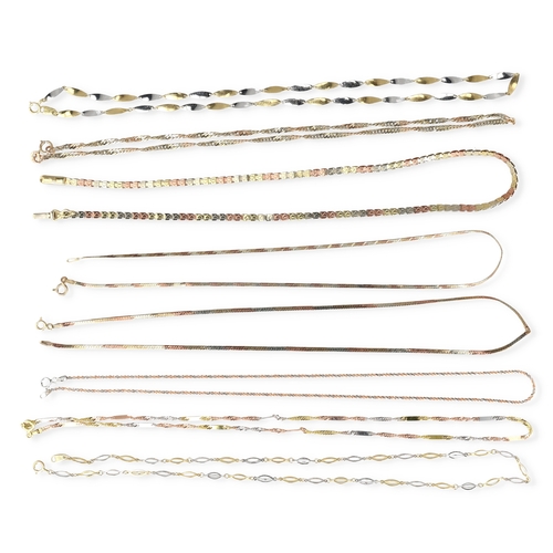 28 - EIGHT 9CT TWO AND THREE COLOUR GOLD NECK CHAINS OF VARYING DESIGNS
Total weight: 24.5 gms... 
