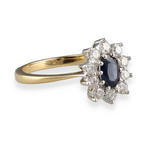 32 - AN 18CT GOLD SAPPHIRE AND DIAMOND CLUSTER RING, 50 POINTS DIAMONDS
Weight: 3.9gms