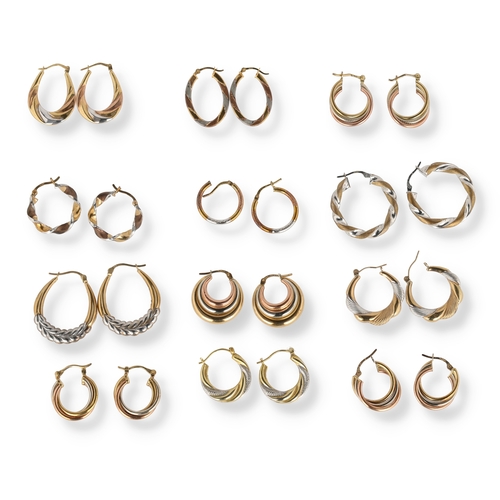 34 - A COLLECTION OF TWELVE PAIRS OF TWO AND THREE COLOUR 9 CARAT GOLD HOOP EARRINGS
Of varying designs, ... 