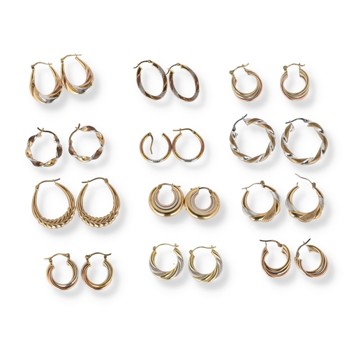 34 - A COLLECTION OF TWELVE PAIRS OF TWO AND THREE COLOUR 9 CARAT GOLD HOOP EARRINGS
Of varying designs, ... 