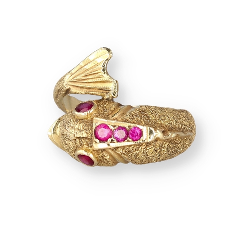 4 - AN 18 CARAT GOLD DRESS RING, CAST AS A DOLPHIN, WITH TEXTURED FINISH AND SET WITH FIVE RUBIES
8.4gms... 