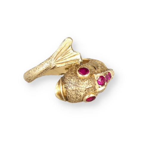 4 - AN 18 CARAT GOLD DRESS RING, CAST AS A DOLPHIN, WITH TEXTURED FINISH AND SET WITH FIVE RUBIES
8.4gms... 