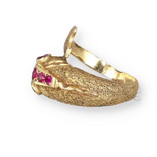 4 - AN 18 CARAT GOLD DRESS RING, CAST AS A DOLPHIN, WITH TEXTURED FINISH AND SET WITH FIVE RUBIES
8.4gms... 