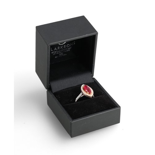 2 - A MODERN 18 CARAT WHITE GOLD AND PLATINUM RUBY AND DIAMOND RING
The marquise cut ruby, weight 2.32ct... 