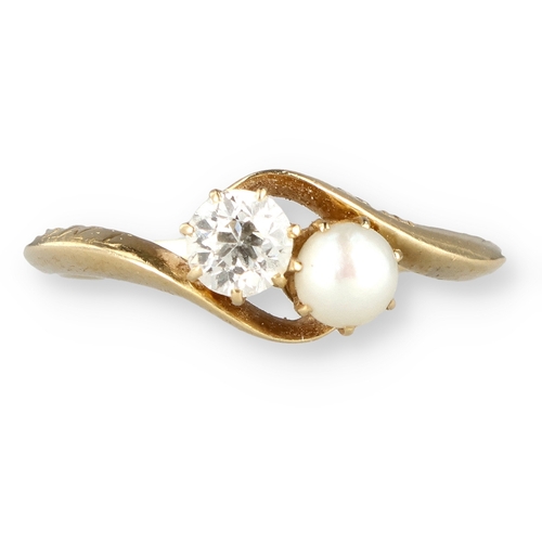23 - AN 18CT GOLD DIAMOND AND PEARL CROSSOVER RING 
Weight: 2.9gms 