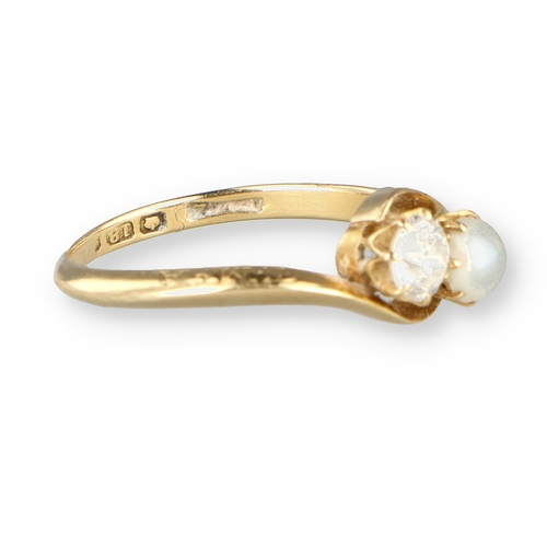 23 - AN 18CT GOLD DIAMOND AND PEARL CROSSOVER RING 
Weight: 2.9gms 