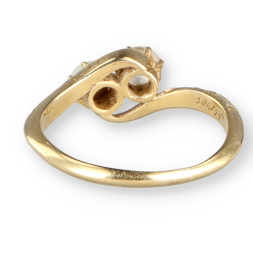 23 - AN 18CT GOLD DIAMOND AND PEARL CROSSOVER RING 
Weight: 2.9gms 