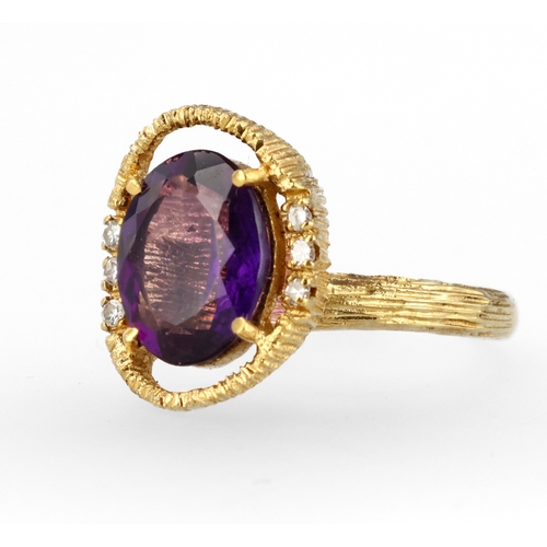 34 - AN 18CT TEXTURED GOLD RING SET WITH AMETHYST AND DIAMONDS
Weight: 6.6gms