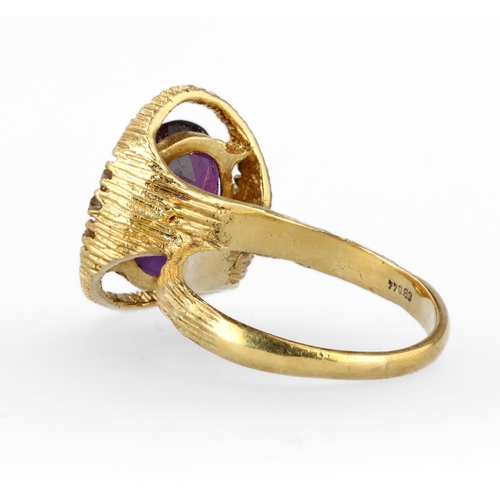 34 - AN 18CT TEXTURED GOLD RING SET WITH AMETHYST AND DIAMONDS
Weight: 6.6gms