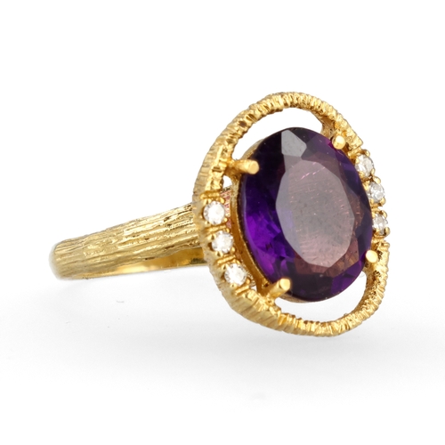34 - AN 18CT TEXTURED GOLD RING SET WITH AMETHYST AND DIAMONDS
Weight: 6.6gms