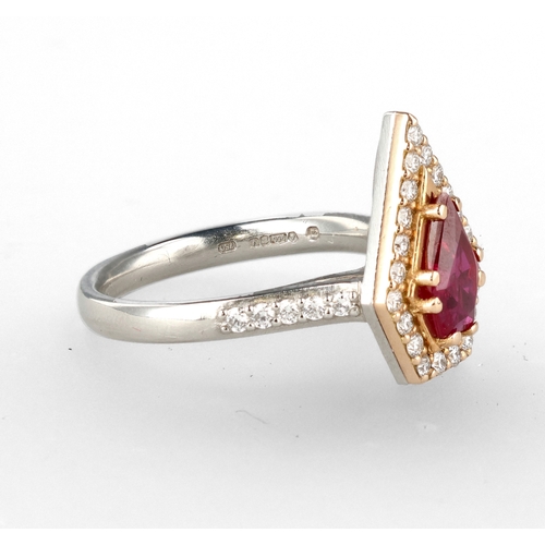 4 - A MODERN 18 CARAT WHITE GOLD AND PLATINUM RUBY AND DIAMOND RING
The fancy cut ruby, weight 1.35cts, ... 
